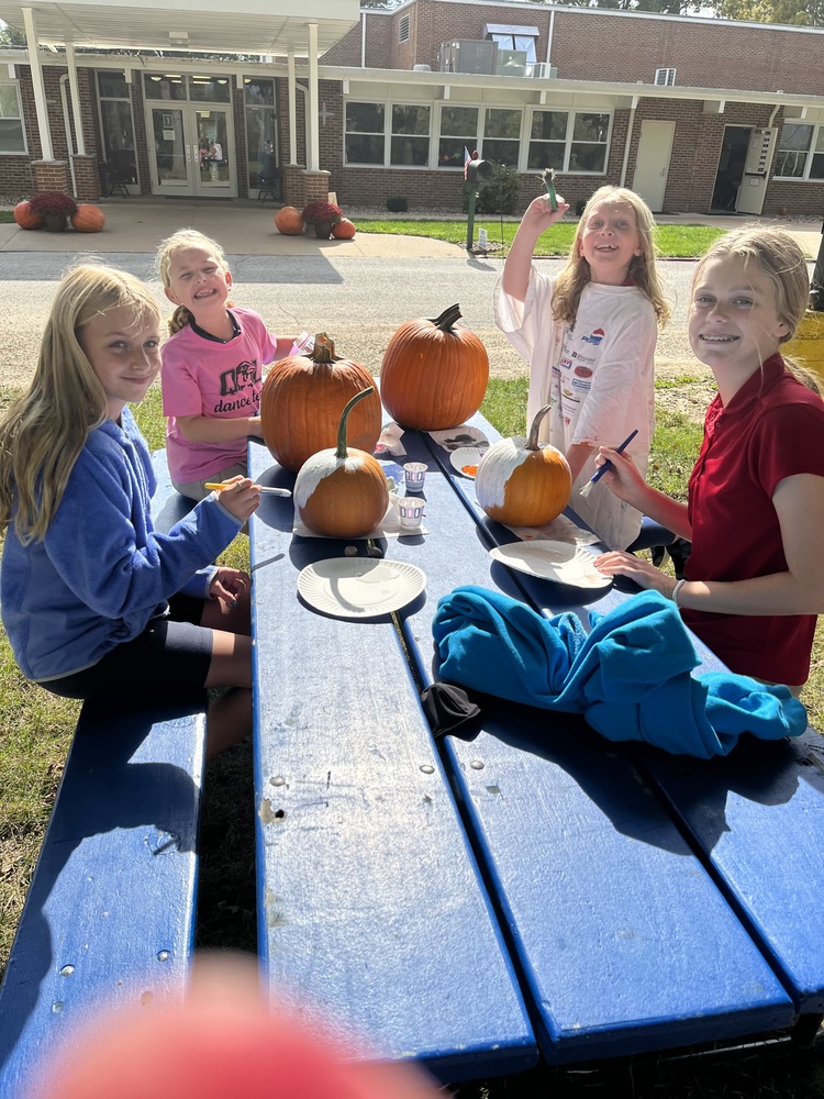 3rd and 7th grade painting pumpkins