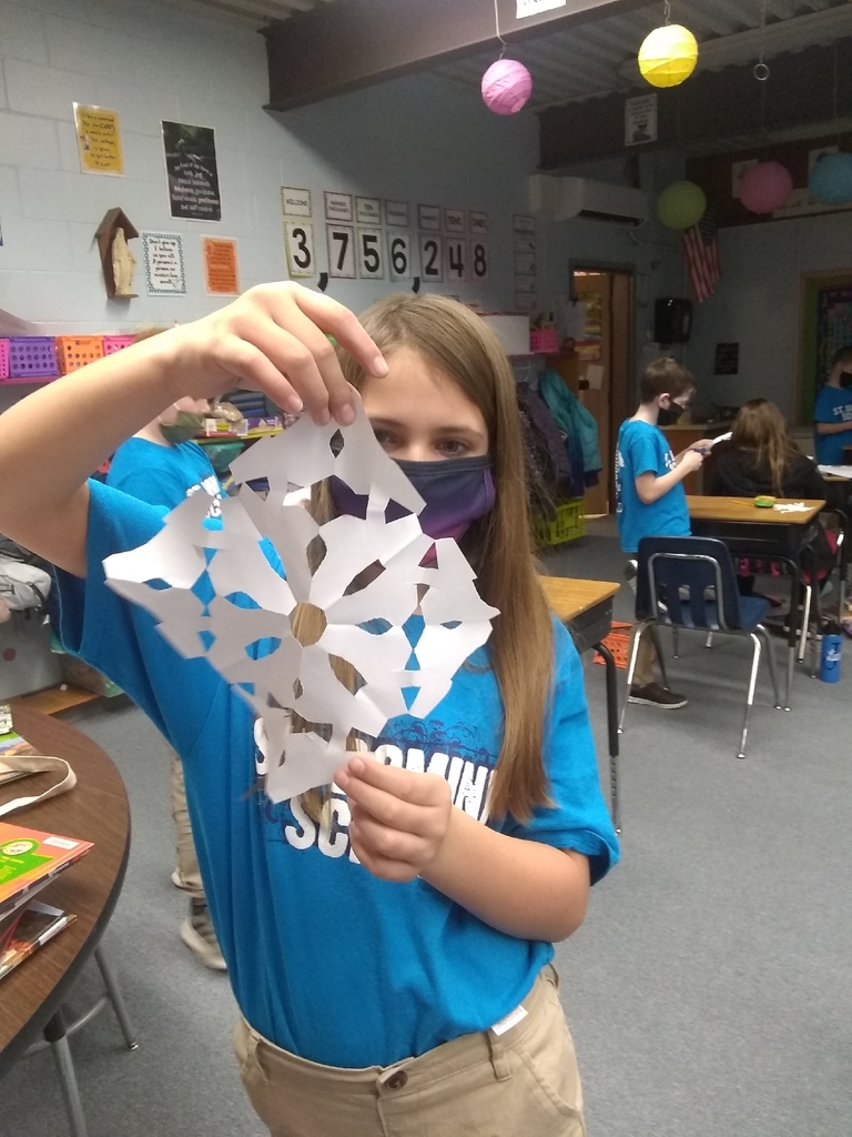 snowflake with child holding it up
